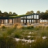 Modern Finnhouse Restaurant met grote glazen ramen en groendak, omringd door hoge grassen en bomen. De uitnodigende patio biedt een unieke eetervaring in de natuur onder een effectieve hemel. - Finnhouse